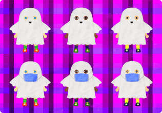 A child wearing a ghost costume and a mask for Halloween