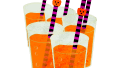 five halloween orange juices with purple and black straws 01