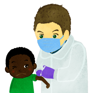 Medical Male Doctor Immunizing A Boy B